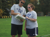 The girls’ thirds soccer coaches strategize on Ayres field.