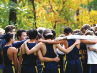 The Boars receive a pep talk from Assistant Coach William Nowak.