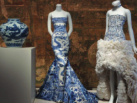 A display of ornate dresses in the Metropolitan Museum of Art’s “China Through the Looking Glass.”