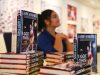 Laurie Hernandez signing copies of her book, I Got This, after School Meeting.
