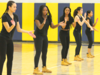 Step Squad leaders Zara Harding, Donessa Colley, Shamari Harrington, and Tiffany Lin lead a dance in their classic ensemble.