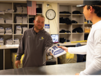 Mr. Justin Whittaker hands out a CRH athletics t-shirt. Photo by Jenny Guo/The Choate News